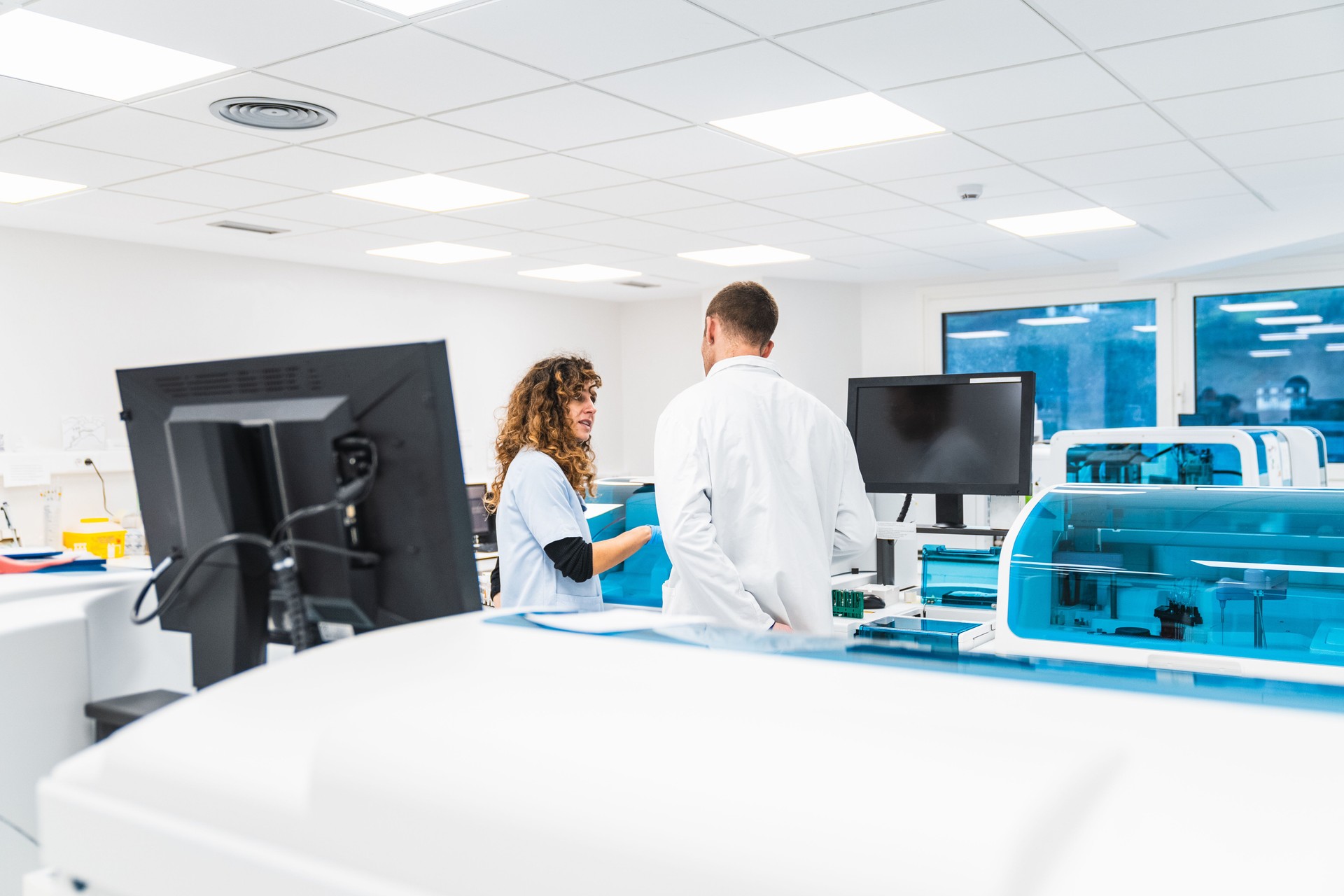 Medical Professionals Discussing in a Clinical Laboratory